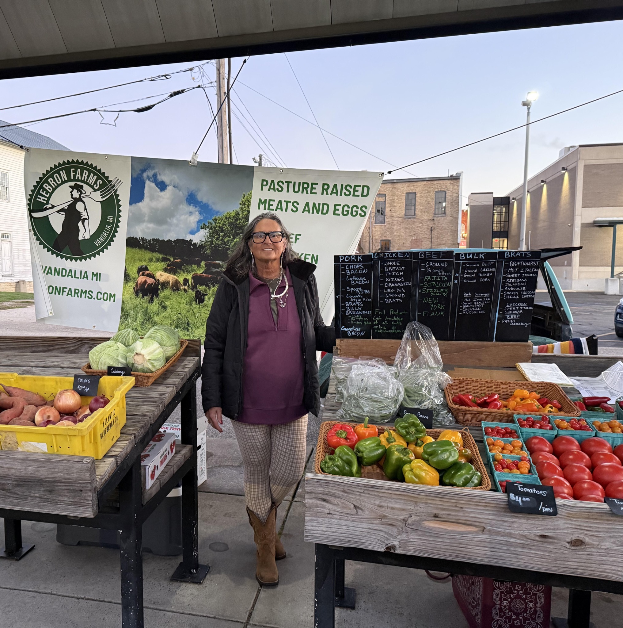 Hebron Farms vendor with vegetables at the Buchanan Farmers’ Market