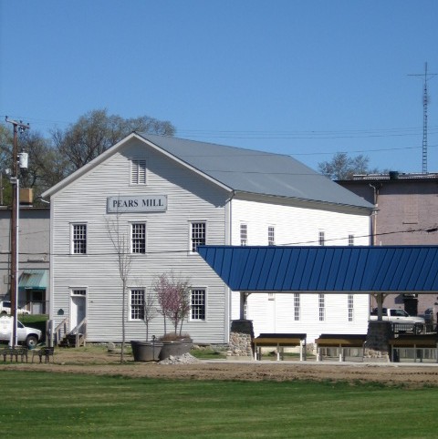 Pears Mill and the blue-roofed pavilion viewed across the Common lawn