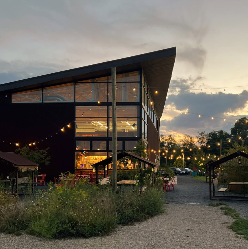 River St. Joe Brewery building and garden at dusk